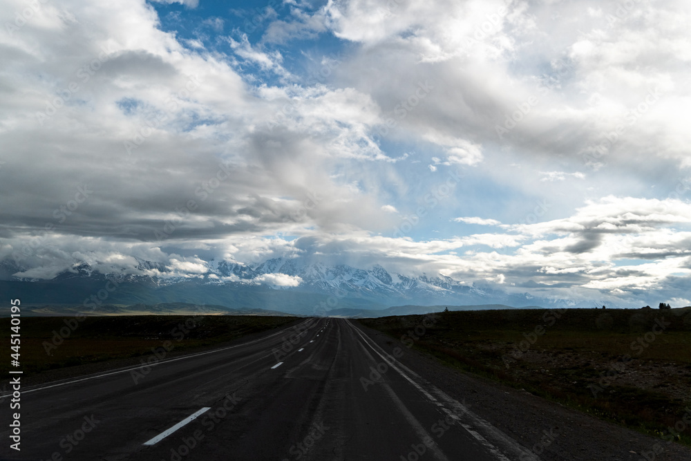 road, mountains, clouds and sky