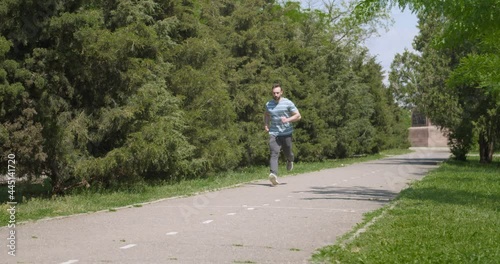 Wallpaper Mural Sporty young man running in park Torontodigital.ca