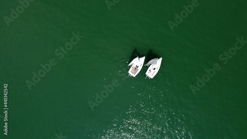Tableau sur toile Aerial drone view of sailing boat on a river.