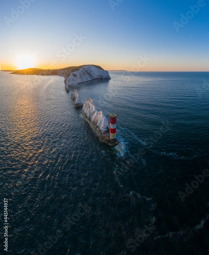 The Needles Isle of Wight with The Needles Lighthouse taken from the air at dawn with a still sea and crisp light. photo