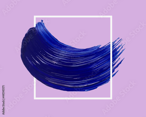 A smear of blue acrylic paint with a frame. A trace of fresh paint from an artistic brush with a glossy texture. A frame, a place for your text, a decorative design element.