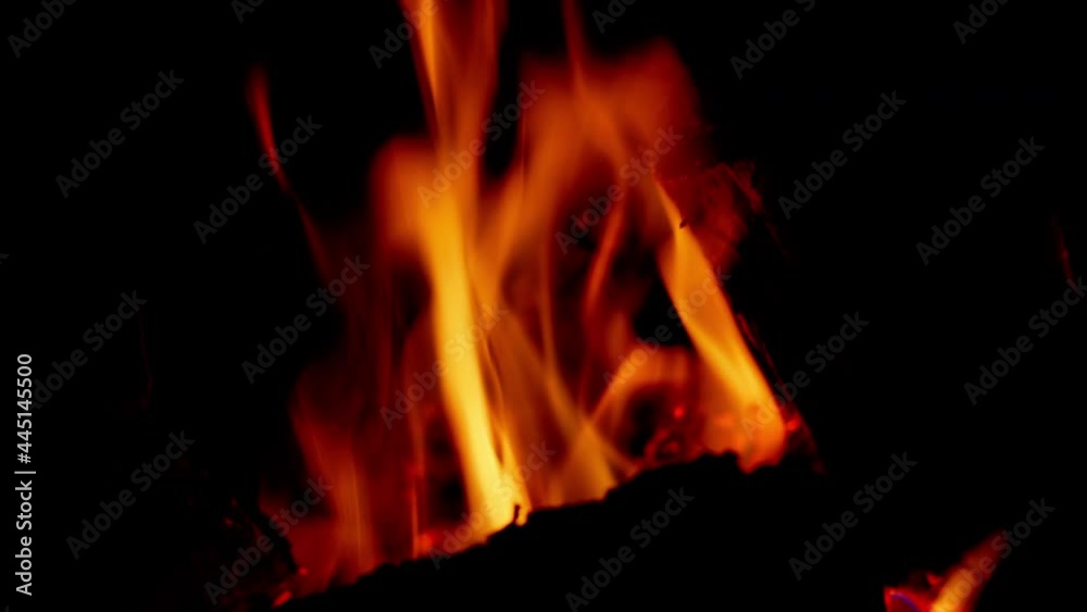 Red particles of charcoal sparks jumpand make amazing view of beauty in fireplace. Sparks fly. Red particles of charcoal sparks jumpand make amazing view of beauty in fireplace. Sparks fly.