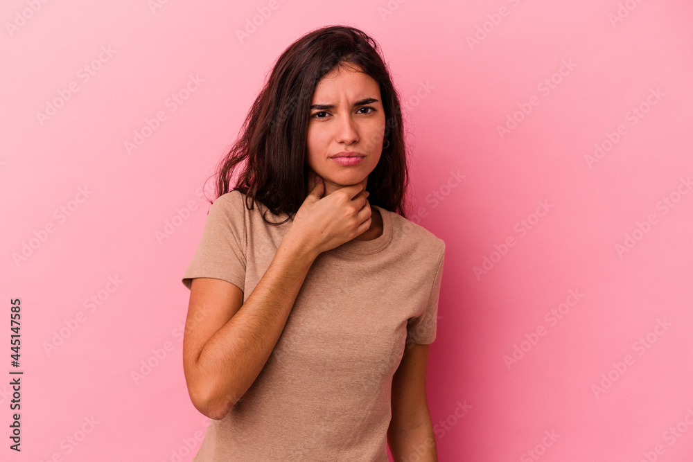 Young caucasian woman isolated on pink background suffers pain in throat due a virus or infection. Young caucasian woman isolated on pink background suffers pain in throat due a virus or infection.