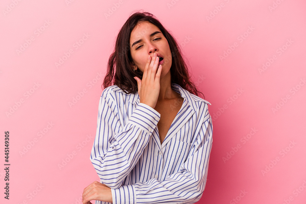 Young caucasian woman isolated on pink background yawning showing a tired gesture covering mouth with hand. Young caucasian woman isolated on pink background yawning showing a tired gesture covering mouth with hand.