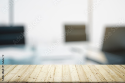 Blank wooden office desk with light workplace with laptop on background  mock up