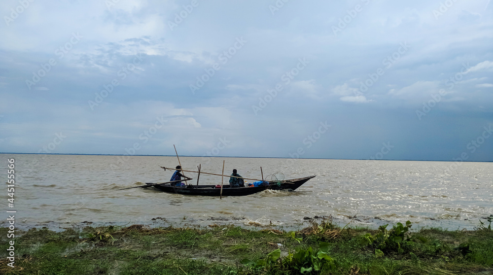 Nature Bangladeshi Padma River with fishing boat Nature Bangladeshi Padma River with fishing boat
