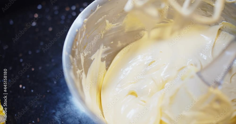 Chef mixing ingredients baking cream cake with flour egg butter and sugar in a bowl, Preparing dessert in the kitchen Chef mixing ingredients baking cream cake with flour egg butter and sugar in a bowl, Preparing dessert in the kitchen