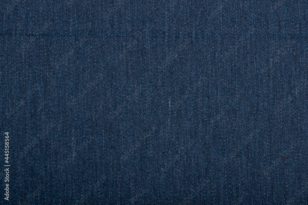 The fabric of blue jeans background texture