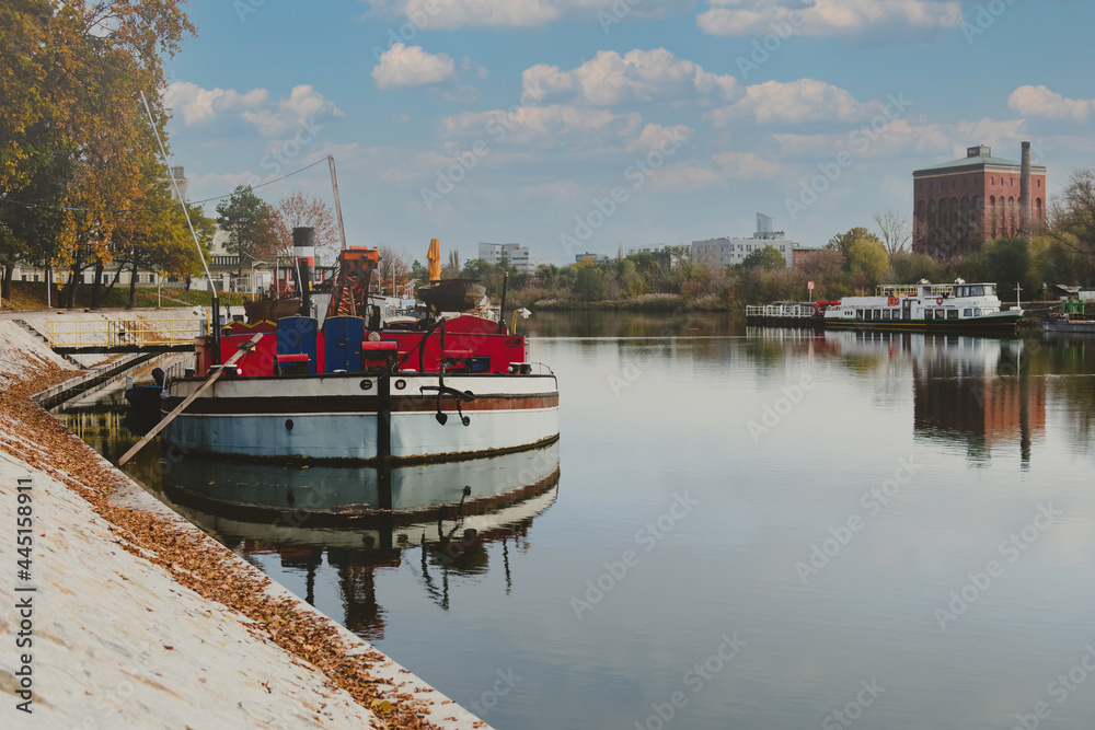 Fototapeta premium boat moored on a river city port