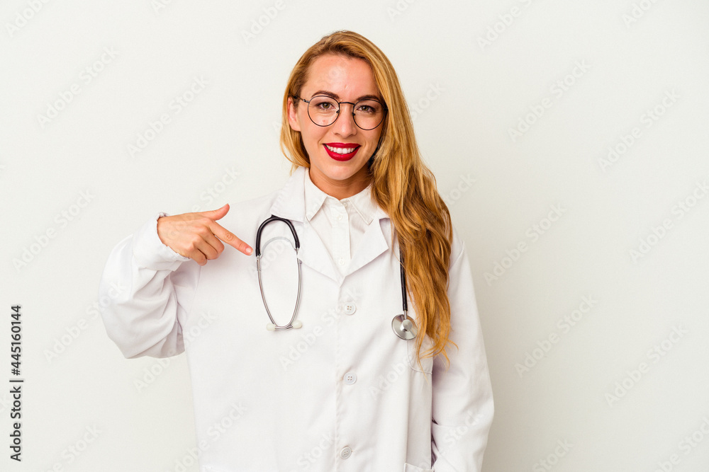 Caucasian doctor woman isolated on white background person pointing by hand to a shirt copy space, proud and confident Caucasian doctor woman isolated on white background person pointing by hand to a shirt copy space, proud and confident