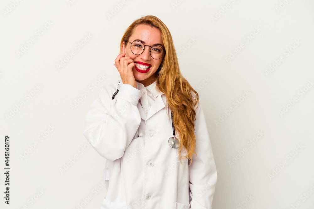 Caucasian doctor woman isolated on white background biting fingernails, nervous and very anxious.
