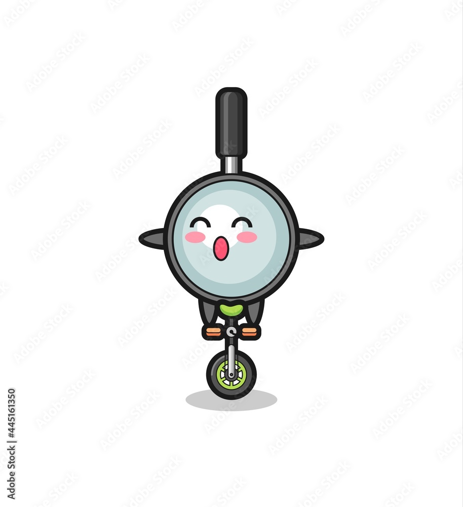 The cute magnifying glass character is riding a circus bike The cute magnifying glass character is riding a circus bike