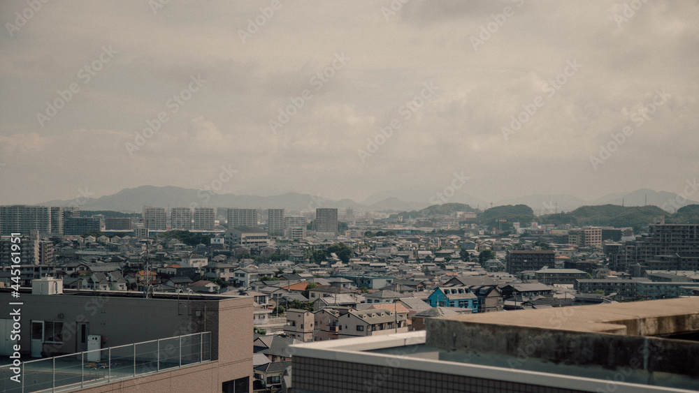 Time clouds over city, Japan