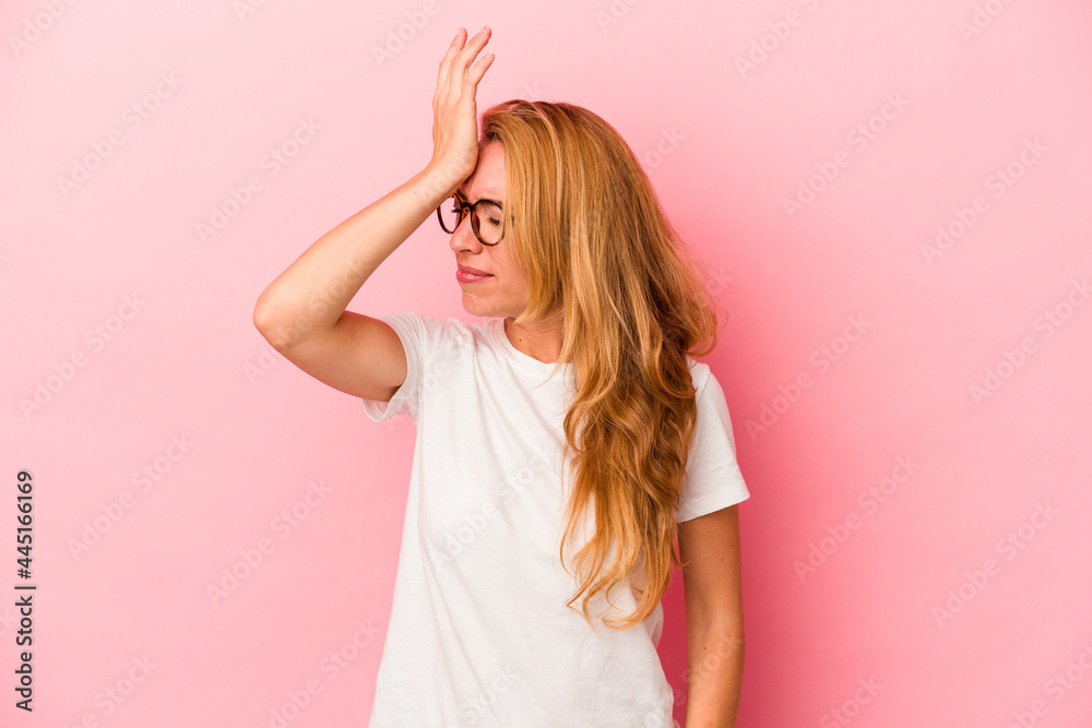 Caucasian blonde woman isolated on pink background forgetting something, slapping forehead with palm and closing eyes. Caucasian blonde woman isolated on pink background forgetting something, slapping forehead with palm and closing eyes.