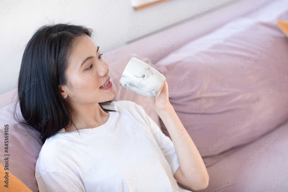 Portrait of asian woman enjoying afternoon tea on apartment interior indoor Portrait of asian woman enjoying afternoon tea on apartment interior indoor