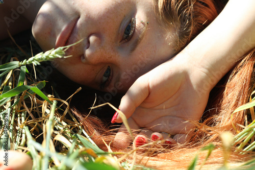 Russian girl in a field with wheat - here she is real freedom