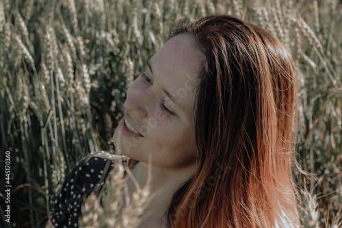 Russian girl in a field with wheat - here she is real freedom