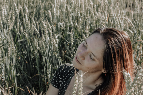 Russian girl in a field with wheat - here she is real freedom