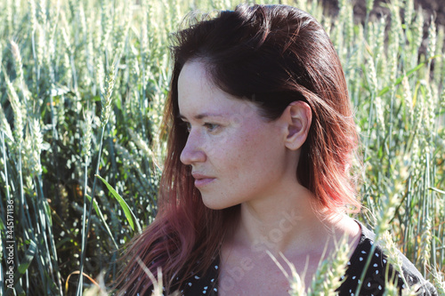 Russian girl in a field with wheat - here she is real freedom