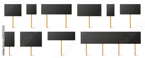 Blank black protest signs with wooden holder. Realistic vector demonstration banner. Strike action cardboard placard mockup.
