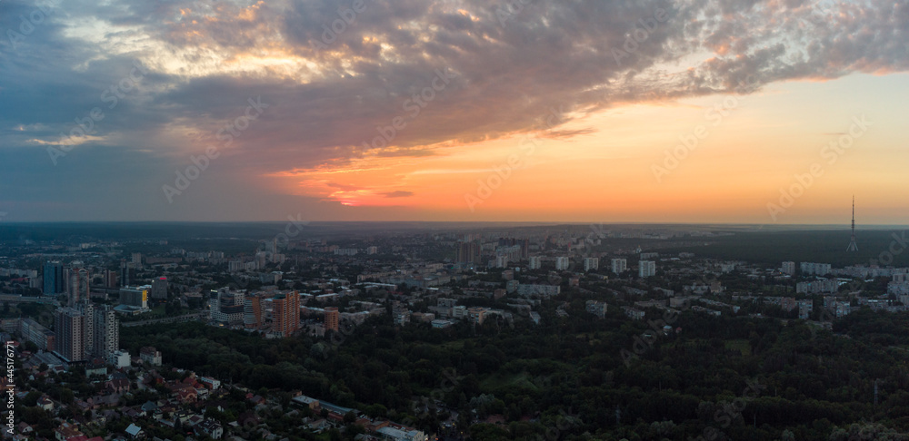 Aerial epic sunset evening cloudscape, panorama view in summer city recreation park Sarzhyn Yar. Botanical garden in residential Shatilovka district area, Pavlovo Pole, Kharkiv Ukraine
