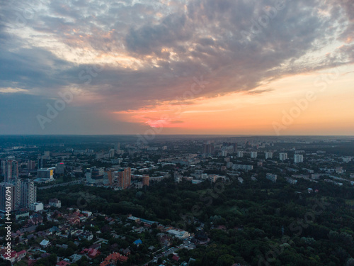 Aerial epic sunset evening cloudscape  panoramic view in summer city recreation park Sarzhyn Yar. Botanical garden in residential Shatilovka district area  Pavlovo Pole  Kharkiv Ukraine