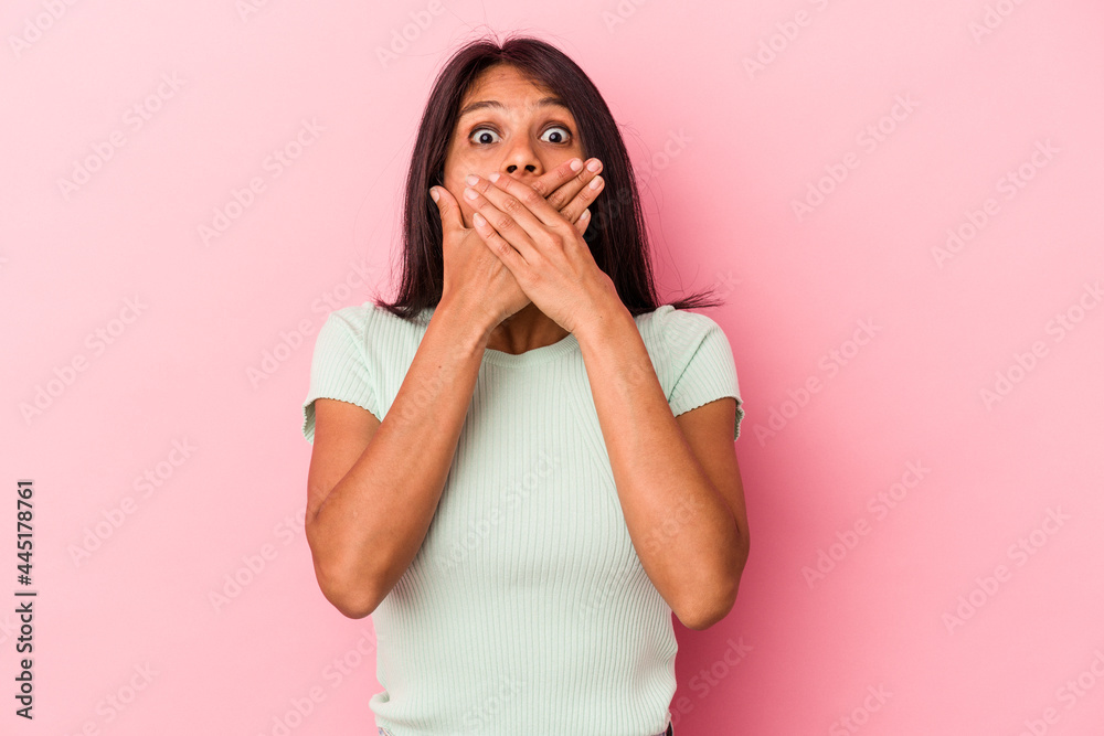 Young latin woman isolated on pink background shocked covering mouth with hands. Young latin woman isolated on pink background shocked covering mouth with hands.