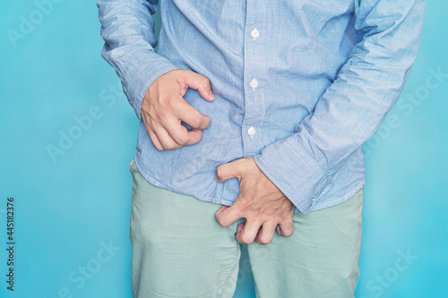 Man scratch the itch with hand, Penis, itching, Concept with Healthcare And Medicine. urinary incontinence. Itching in the groin. photo