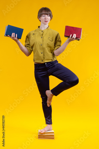 Woman with books stands on ...