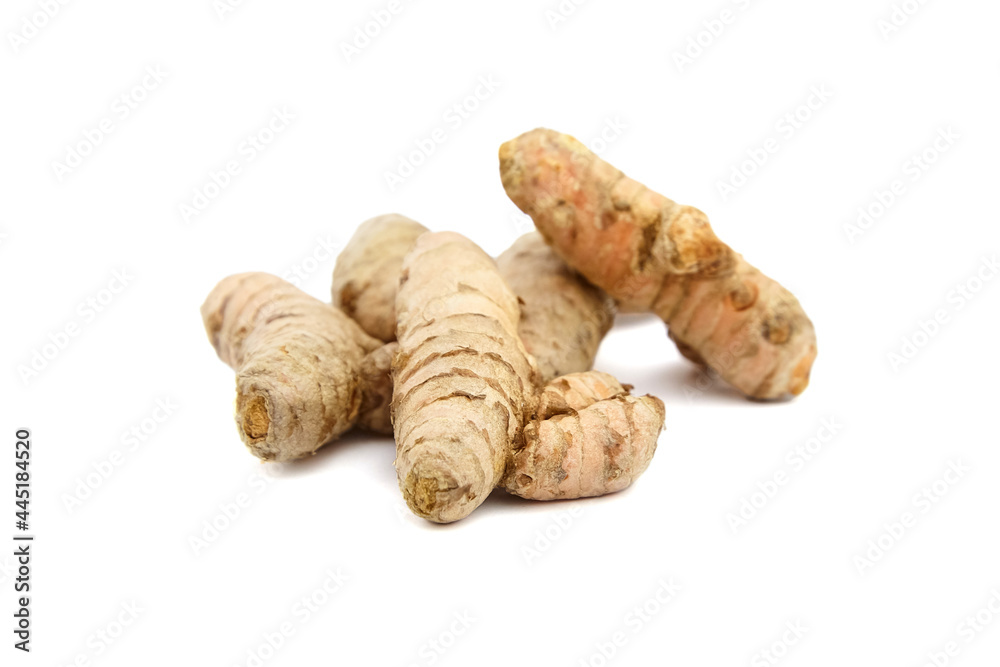 Turmeric spice rhizome isolated on white background. Heap of curcuma longa roots. Oriental spice Turmeric spice rhizome isolated on white background. Heap of curcuma longa roots. Oriental spice