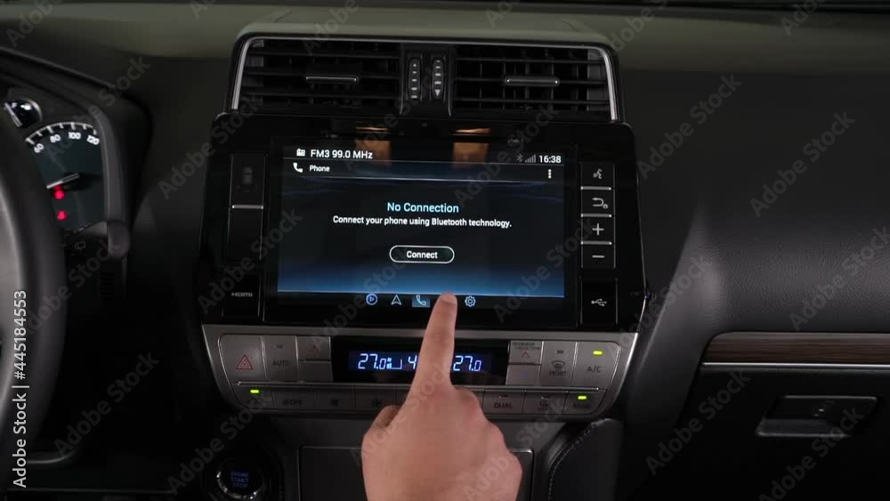 the driver controls the on-board computer in the car