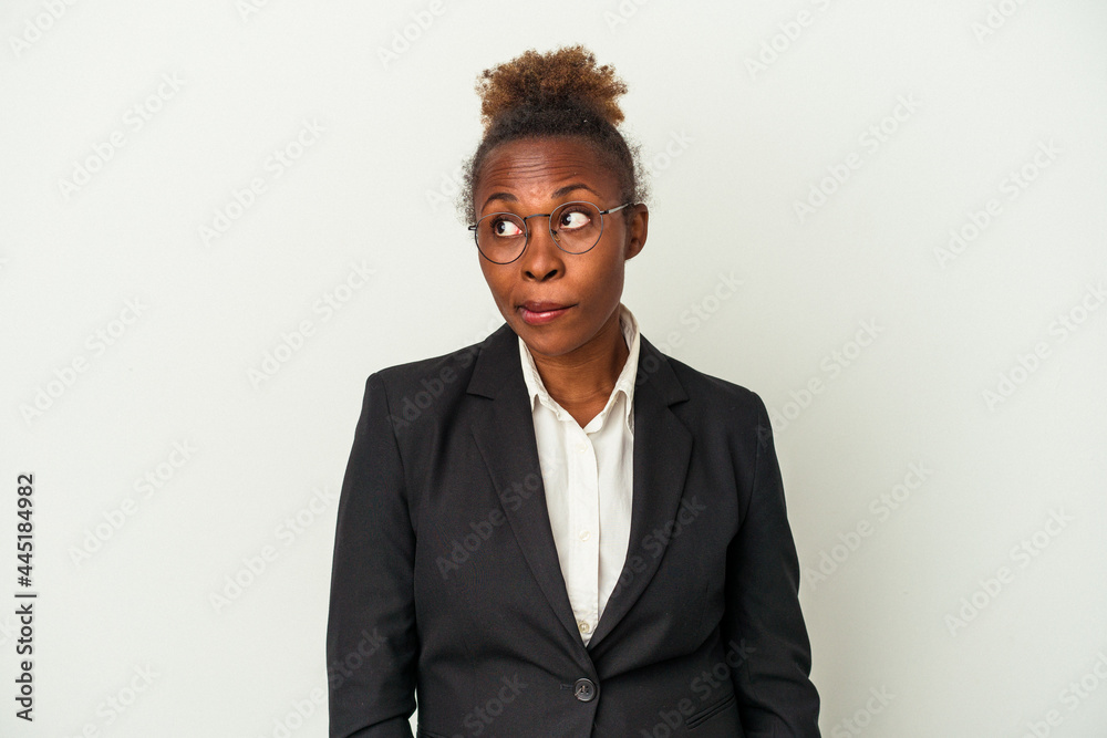 Young business african american woman isolated on white background confused, feels doubtful and unsure.