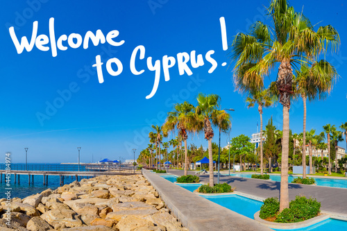 Limassol city in Cyprus. Welcome to Cyprus inscription over city of Limassol. Travel to  beaches of Cypriot. Limassol city marina with palm trees. Tourism in Cyprus. Cypriot resort landscape. photo