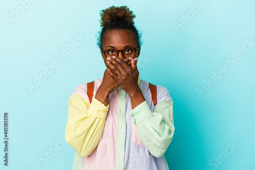Tableau sur toile Young student african american woman over isolated background shocked covering mouth with hands