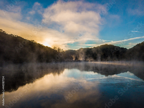 Sunrise over foggy lake © WrongBird
