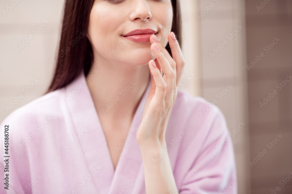 Cropped photo of young attractive woman apply finger lips balm pomade make up visage beauty routine indoors Cropped photo of young attractive woman apply finger lips balm pomade make up visage beauty routine indoors