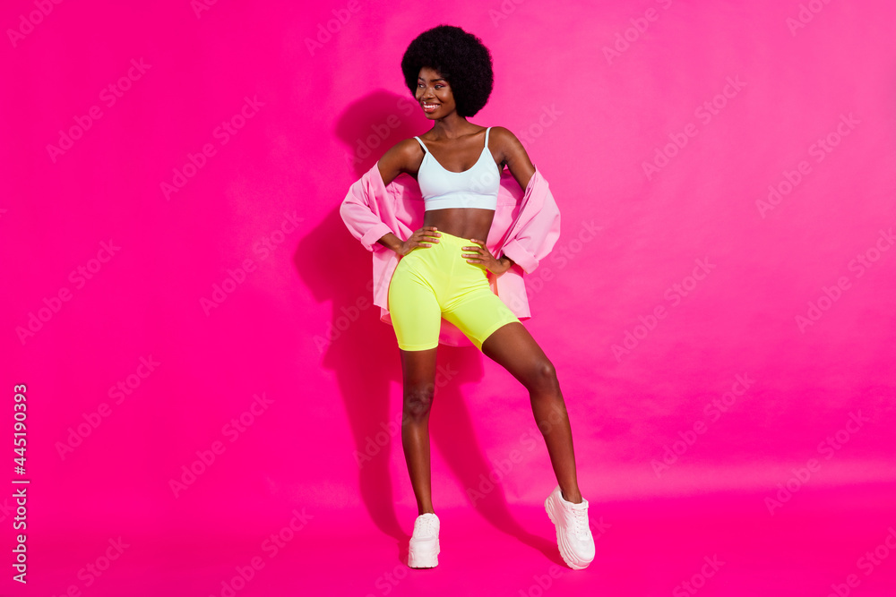 Photo of charming cute dark skin lady wear casual shirt looking empty space smiling isolated pink color background Photo of charming cute dark skin lady wear casual shirt looking empty space smiling isolated pink color background