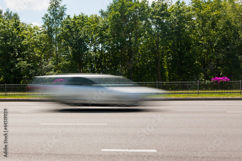 The motion of a blurred car along the street in the daytime. © leon134865