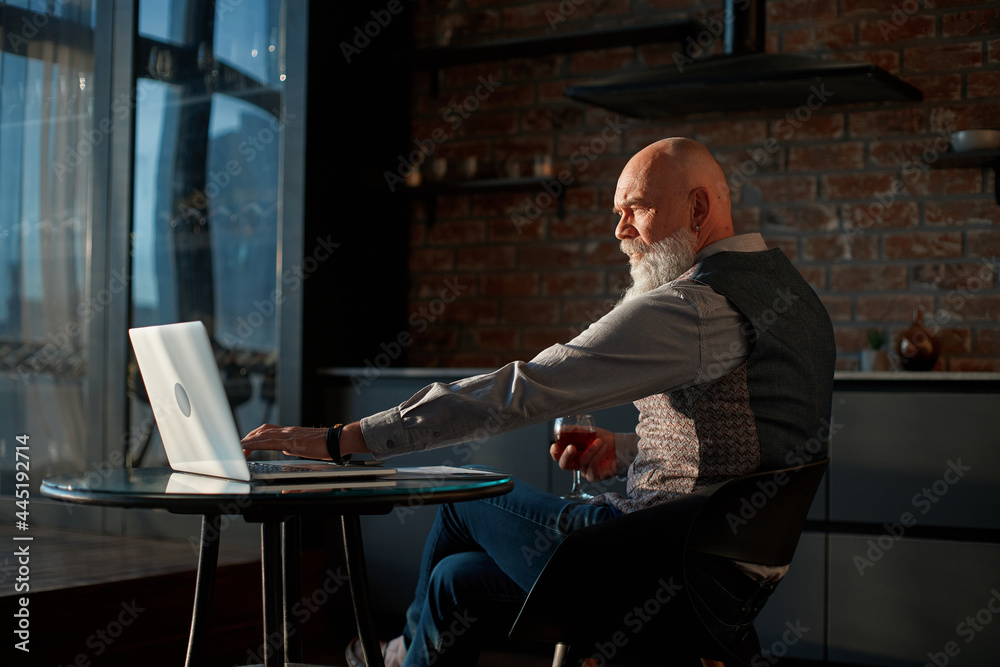 male freelancer works on a laptop at night .