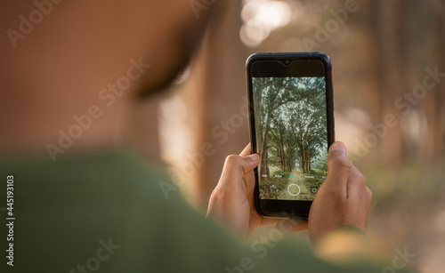 Man taking photo by phone, Mobile photographer clicking nature