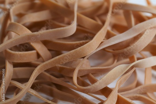 Most rubber bands are manufactured out of natural rubber  also called India rubber  latex  Amazonian rubber  or caoutchouc.