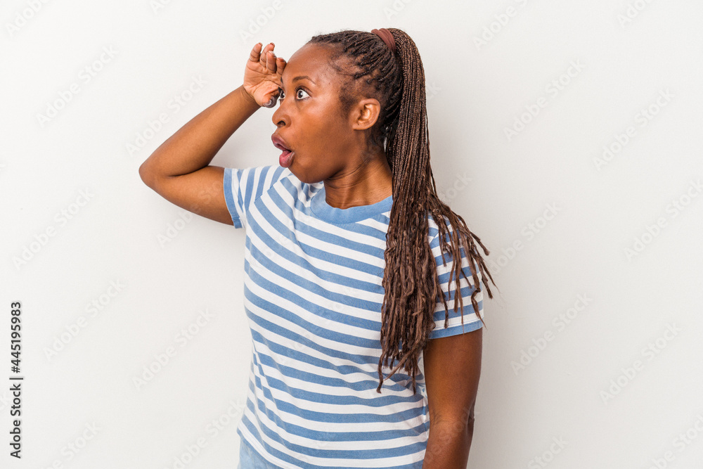 Young african american woman isolated on white background looking far away keeping hand on forehead. Young african american woman isolated on white background looking far away keeping hand on forehead.
