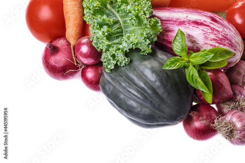 Various vegetables at right top corner on white close-up