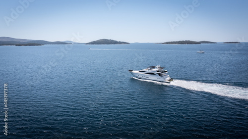 Aerial view of luxury speedboat yacht cruising over mediterranean sea. © Jag_cz
