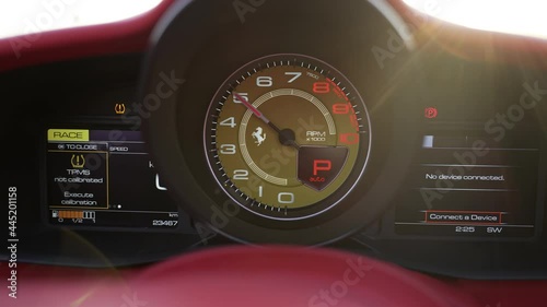 dashboard of a sports car. speedometer and tachometer close-up