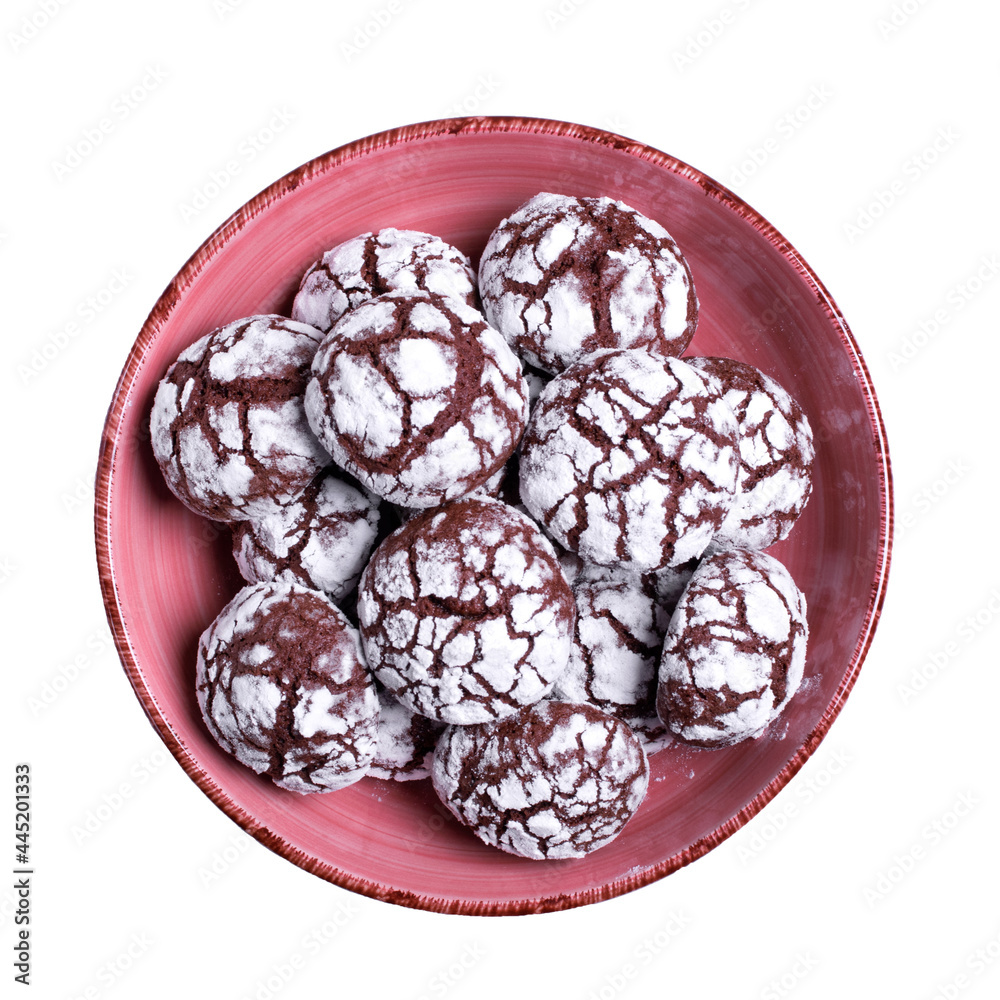 Fototapeta premium Chocolate crinkle cookies in the ceramic bowl isolated on white