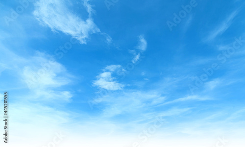 Summer Blue Sky and white cloud white background. Beautiful clear cloudy in sunlight calm season. Panoramic vivid cyan cloudscape in nature environment. Outdoor horizon skyline with spring sunshine. © Art Stocker