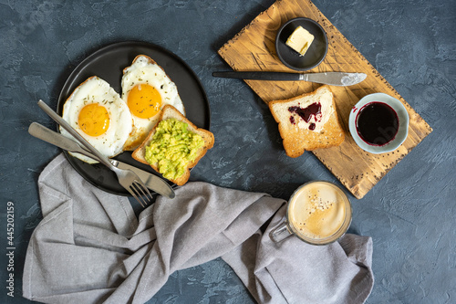 Fried eggs with toast, jam and coffee mug Breakfast concept Top view Typical hotel breakfast