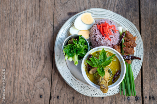 Green curry with rice vintage thai food on wooden table