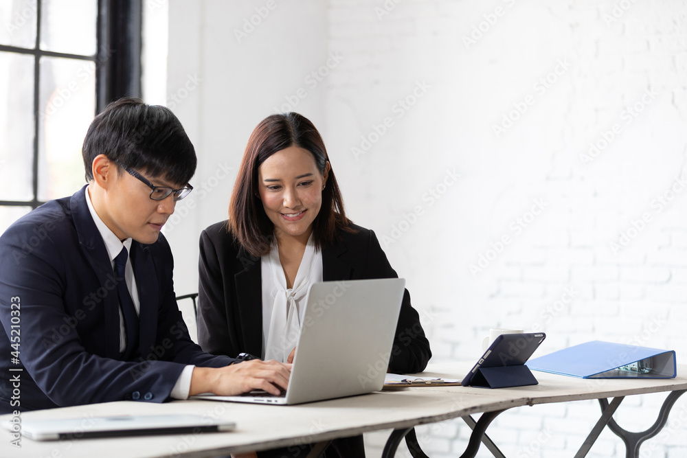 businessman and businesswoman talking about work or project in office businessman and businesswoman talking about work or project in office